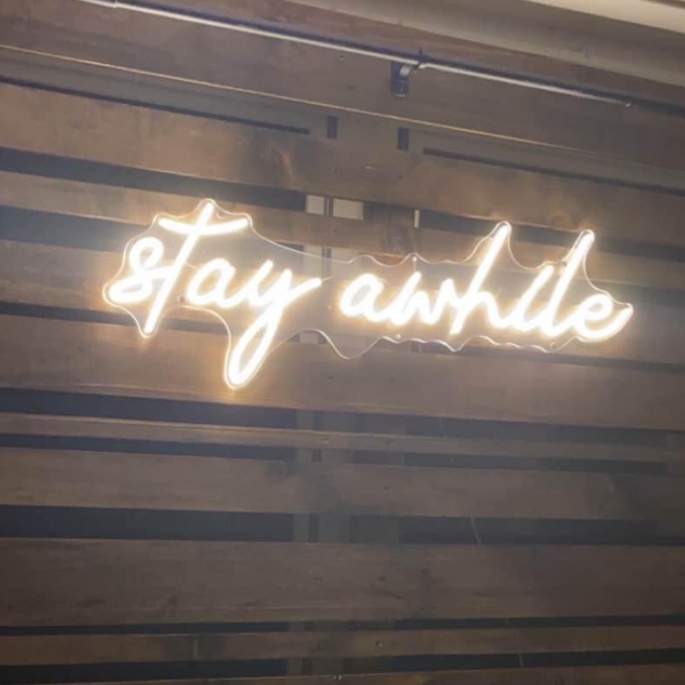 Neon 'Stay Awhile' Wall Sign